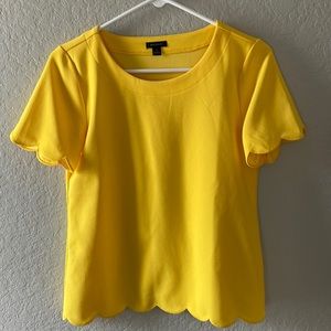 Yellow short sleeve blouse. New without tags. This is Ann taylor brand size XS.